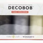 A close up of Violet craft DecoBob piecing pack.