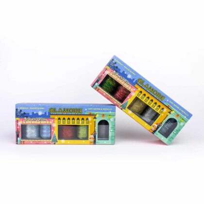 A close-up of GlaMore™ 12wt Rayon & Metallic Thread Holiday Pack.