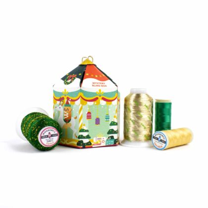 A close-up of our Mystery Blind Box Holiday Pack, featuring a curated selection of machine embroidery thread for festive projects.