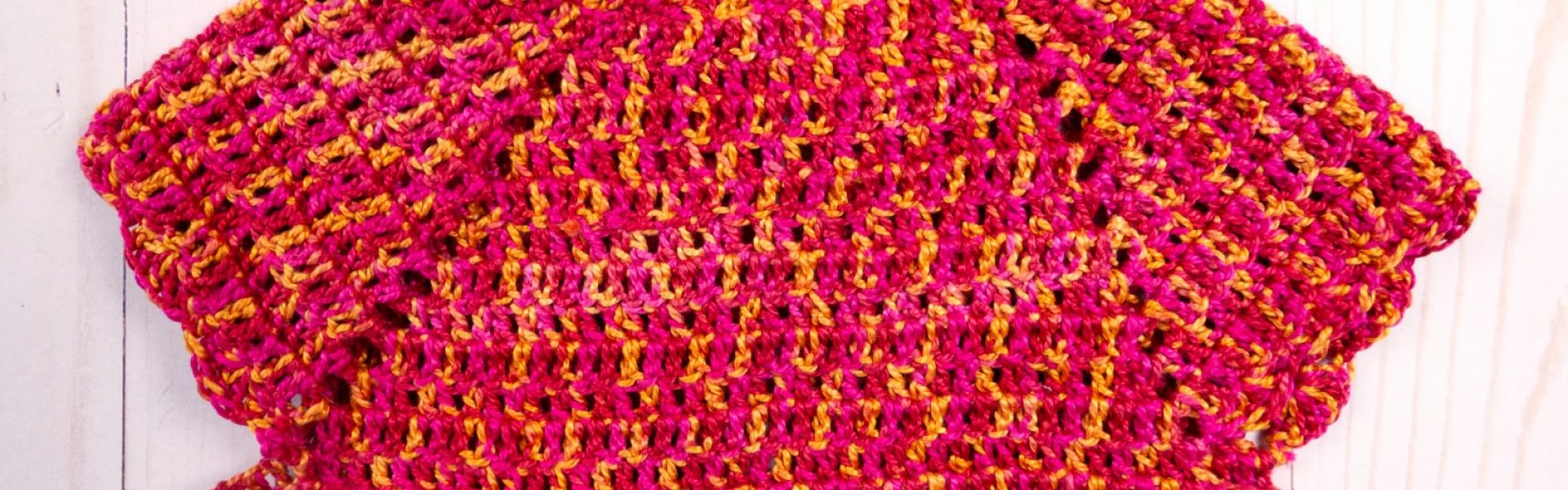 A photo of a little girl's crochet dress top using Eleganza #3 perle cotton thread.