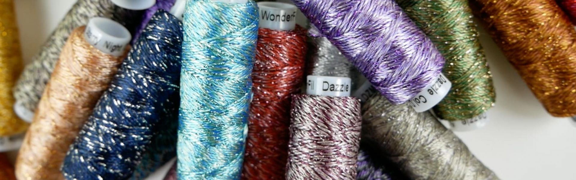 A close up of Starry Night Dazzle 8wt rayon and metallic thread.